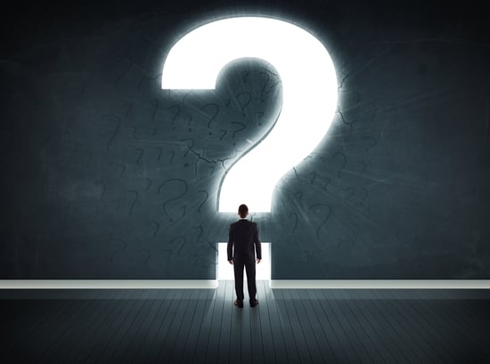 Business man looking at wall with a bright question mark asking questions Investors Ask About Series B Technical Due Diligence