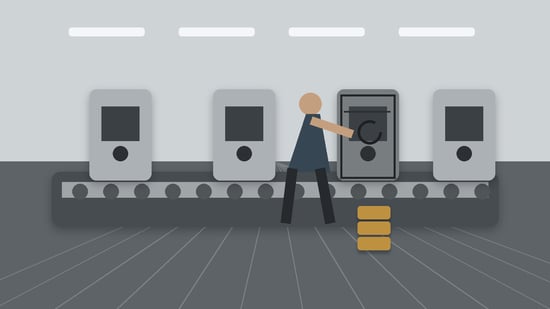 Technician resetting a recurring fault on an industrial production line while surrounding machinery continues operating.