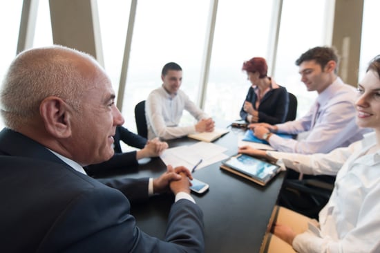 A potential business investors evaluating the team before making an investment