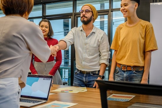 A startup team in a funding-round meeting around a conference table